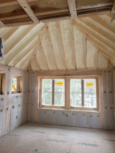 Insulation installed in an unfinished home's ceiling and walls.